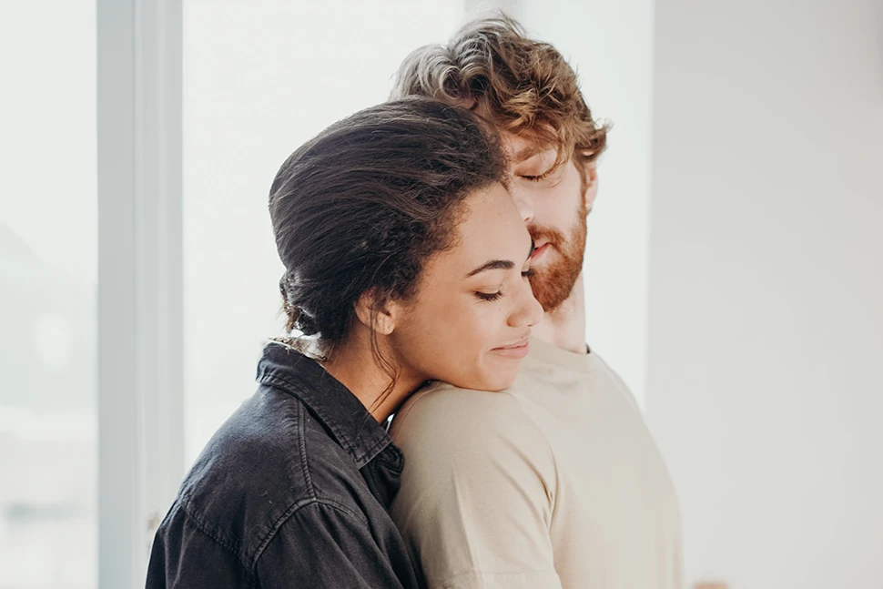 Woman hugging a man from behind